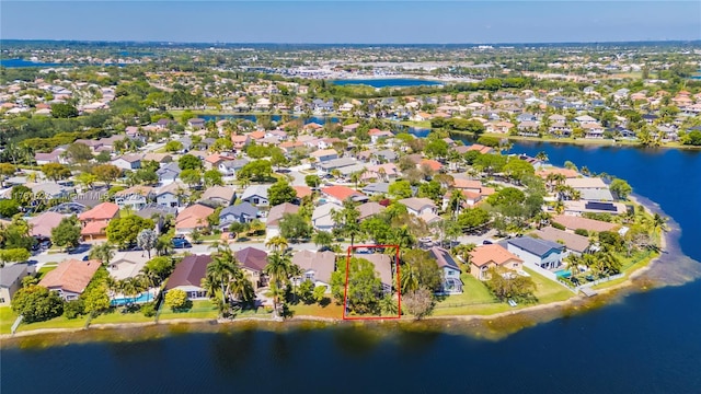 aerial view with a water view and a residential view