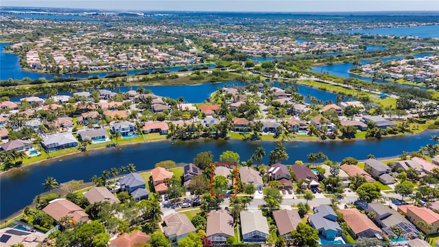 bird's eye view featuring a water view and a residential view