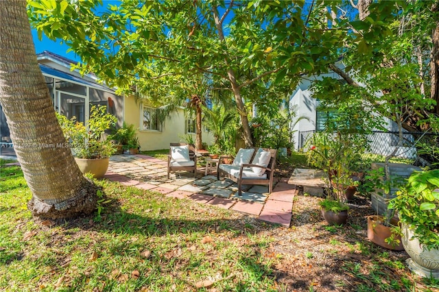 view of yard featuring fence, a patio, and an outdoor living space
