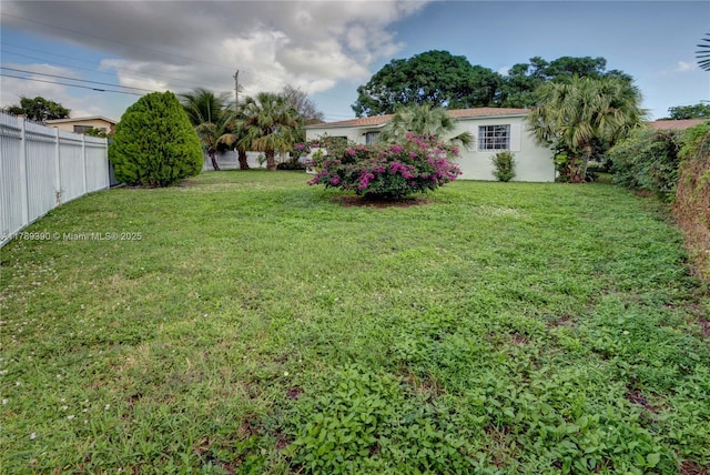 view of yard with fence