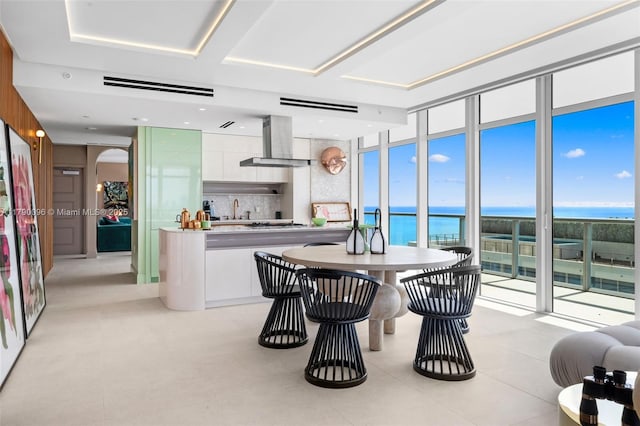 3737 Collins Ave Unit S-1303, Miami Beach, FL 33140 - dining area with floor to ceiling windows, a water view, and arched walkways