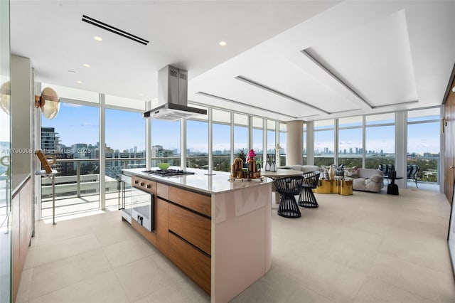 3737 Collins Ave Unit S-1303, Miami Beach, FL 33140 - sunroom with a skyline view, a wall of windows, healthy amount of natural light, and tile patterned flooring