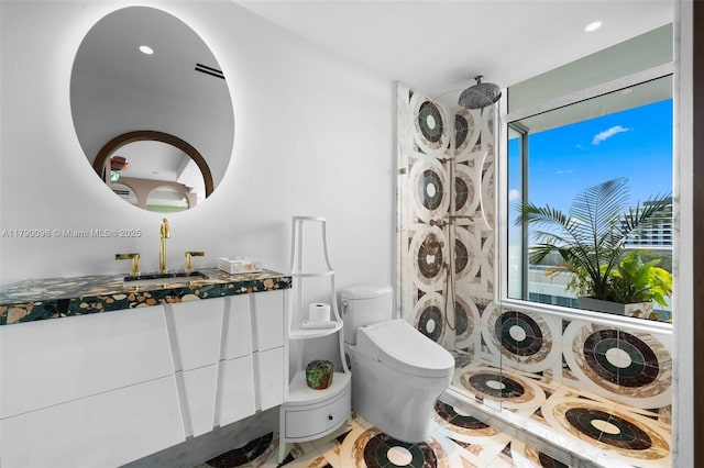 3737 Collins Ave Unit S-1303, Miami Beach, FL 33140 - full bathroom featuring tiled shower, vanity, toilet, and recessed lighting