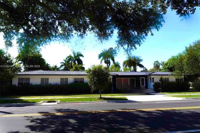 single story home featuring stucco siding