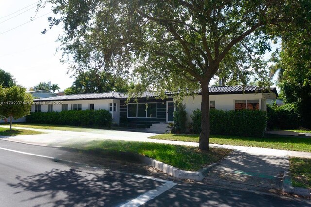 1955 SW 5th Ave, Miami, FL 33129 - single story home with a tiled roof and stucco siding