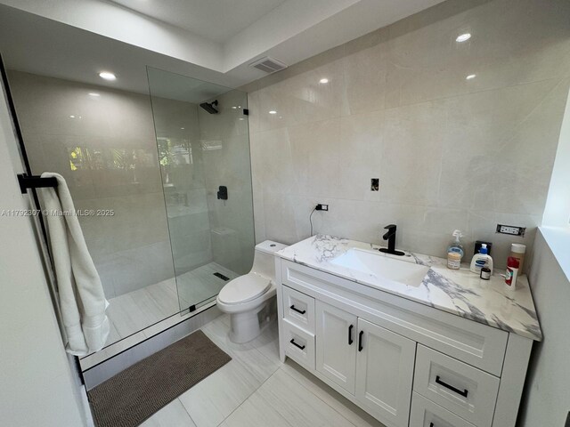 1955 SW 5th Ave, Miami, FL 33129 - full bath featuring tile walls, toilet, visible vents, a walk in shower, and vanity