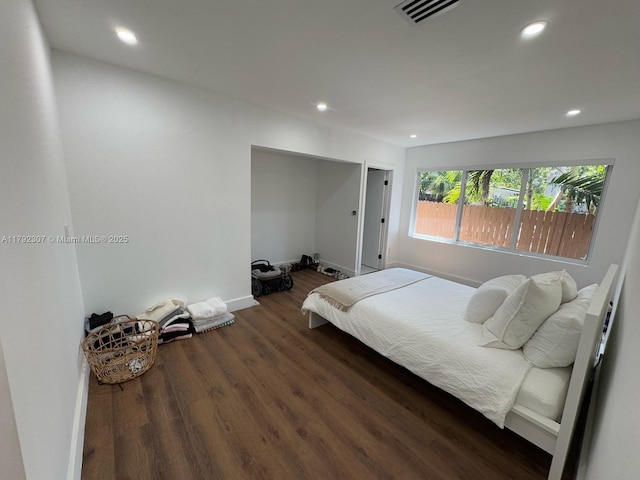 bedroom with recessed lighting, visible vents, and wood finished floors