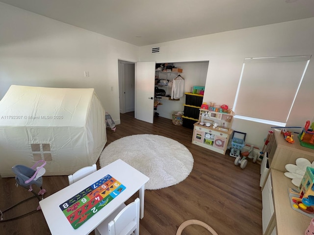 game room with visible vents and wood finished floors