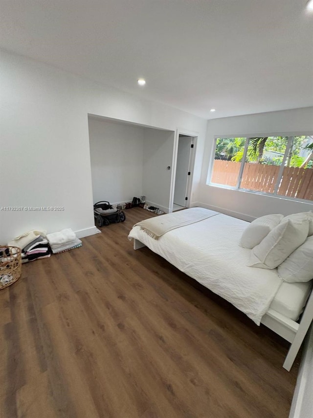 bedroom featuring recessed lighting, baseboards, and wood finished floors