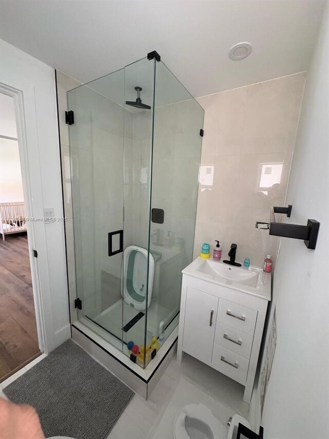 1955 SW 5th Ave, Miami, FL 33129 - bathroom featuring a stall shower, vanity, and tile walls