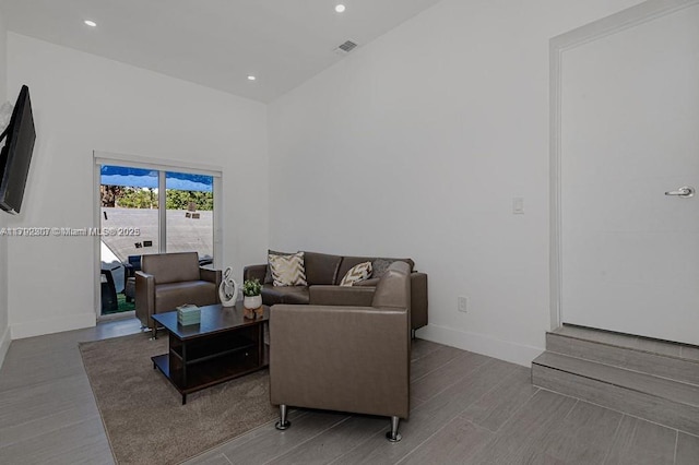 living room with baseboards, recessed lighting, visible vents, and wood finished floors