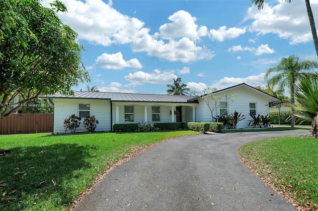 16840 SW 87th Ave, Palmetto Bay, FL 33157 - single story home featuring asphalt driveway, a standing seam roof, and a metal roof
