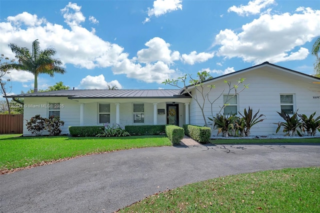 16840 SW 87th Ave, Palmetto Bay, FL 33157 - ranch-style house featuring a standing seam roof, a metal roof, and a porch