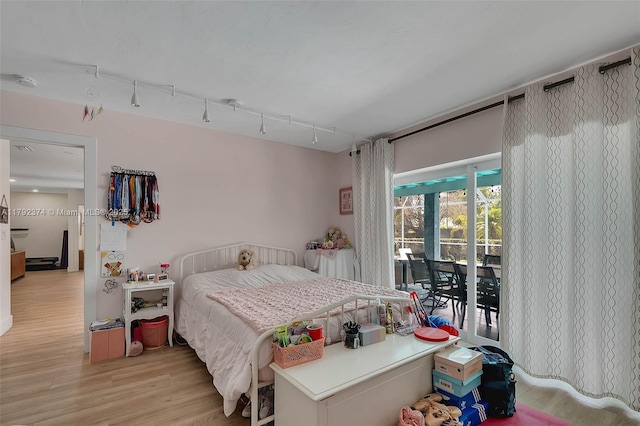 16840 SW 87th Ave, Palmetto Bay, FL 33157 - bedroom with access to exterior and light wood-style flooring