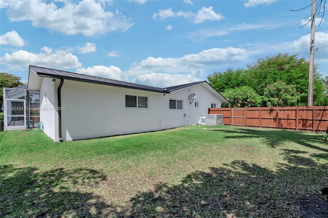 16840 SW 87th Ave, Palmetto Bay, FL 33157 - back of house with stucco siding, a standing seam roof, a metal roof, and a lanai