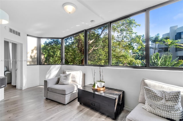 sunroom / solarium with visible vents and a healthy amount of sunlight