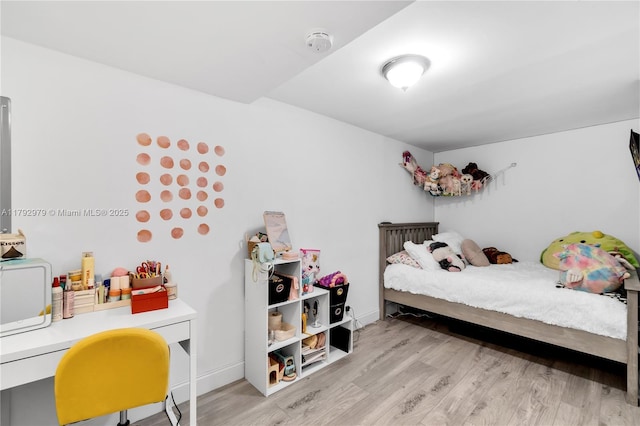 bedroom featuring wood finished floors