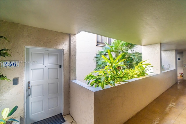 property entrance featuring stucco siding