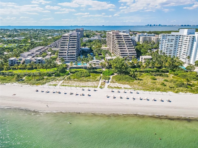 aerial view featuring a water view and a view of the beach