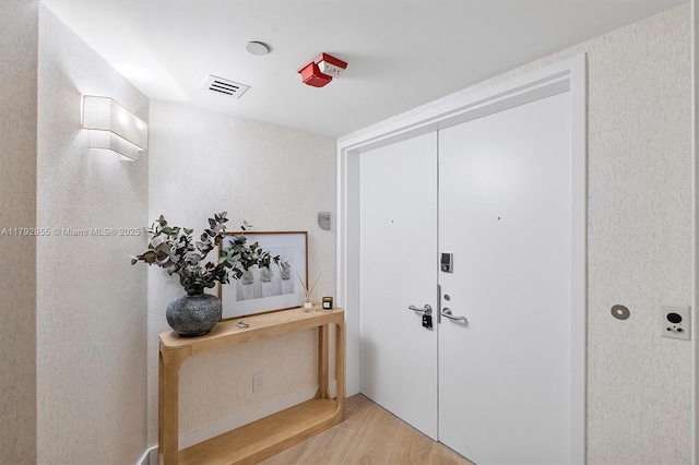 2127 Brickell Ave Unit 2704, Miami, FL 33129 - entrance foyer with wood finished floors and visible vents