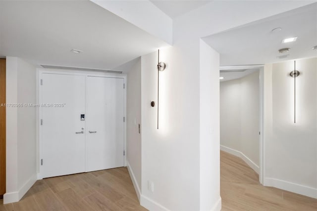 2127 Brickell Ave Unit 2704, Miami, FL 33129 - hall featuring baseboards and light wood-type flooring