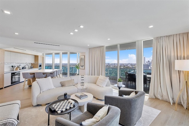 2127 Brickell Ave Unit 2704, Miami, FL 33129 - living area featuring light wood-type flooring and expansive windows