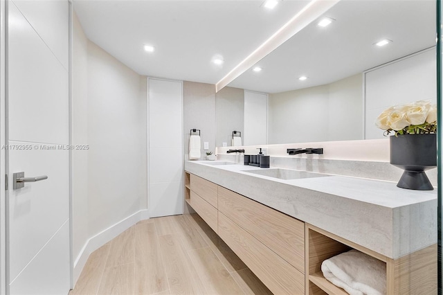2127 Brickell Ave Unit 2704, Miami, FL 33129 - full bath with a sink, double vanity, recessed lighting, and wood finished floors