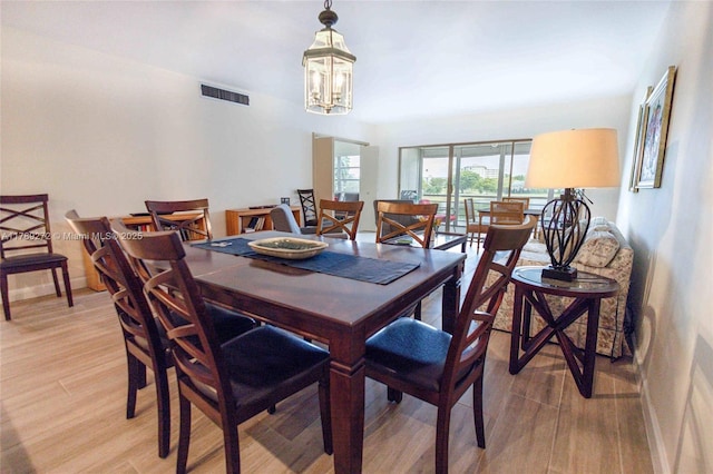 2751 N Palm Aire Dr Unit 310, Pompano Beach, FL 33069 - dining area featuring light wood-style flooring