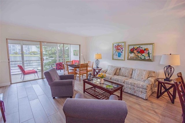 2751 N Palm Aire Dr Unit 310, Pompano Beach, FL 33069 - living room with wood finished floors