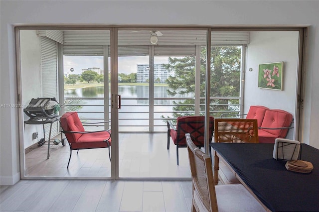 2751 N Palm Aire Dr Unit 310, Pompano Beach, FL 33069 - dining room with a water view and wood finished floors