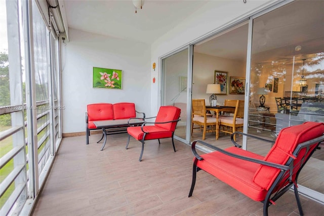 2751 N Palm Aire Dr Unit 310, Pompano Beach, FL 33069 - sunroom featuring plenty of natural light, baseboards, and wood finished floors
