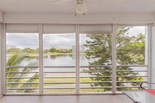 2751 N Palm Aire Dr Unit 310, Pompano Beach, FL 33069 - unfurnished sunroom featuring a water view