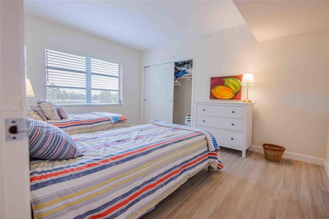 2751 N Palm Aire Dr Unit 310, Pompano Beach, FL 33069 - bedroom featuring wood finished floors, baseboards, and a closet