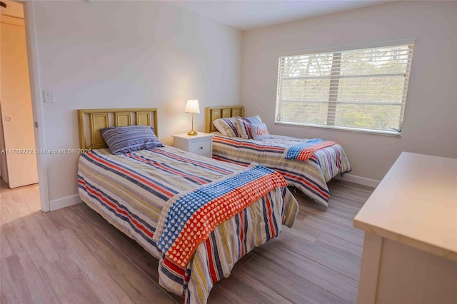 2751 N Palm Aire Dr Unit 310, Pompano Beach, FL 33069 - bedroom with baseboards and light wood finished floors