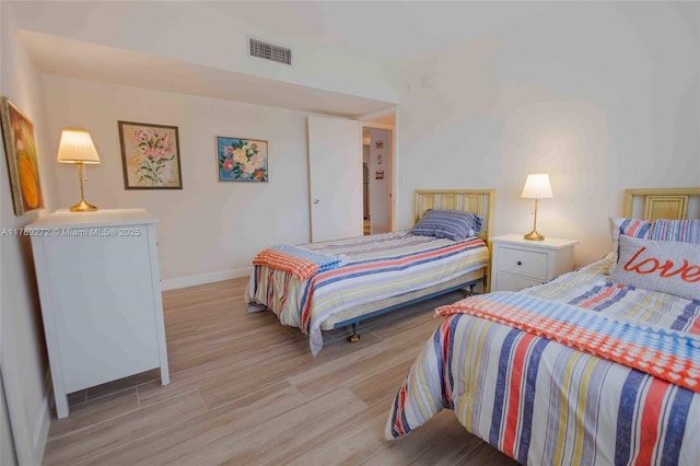 2751 N Palm Aire Dr Unit 310, Pompano Beach, FL 33069 - bedroom with baseboards and light wood finished floors