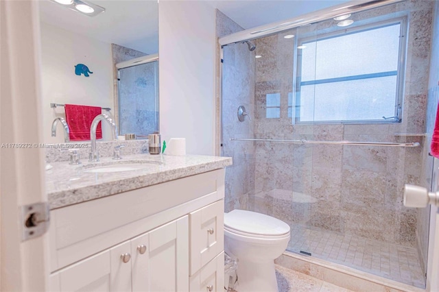 2751 N Palm Aire Dr Unit 310, Pompano Beach, FL 33069 - bathroom featuring vanity, toilet, and a shower stall