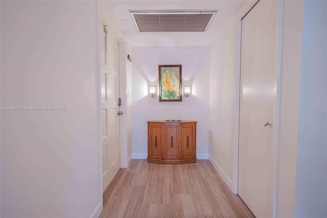 2751 N Palm Aire Dr Unit 310, Pompano Beach, FL 33069 - corridor featuring light wood-type flooring and baseboards