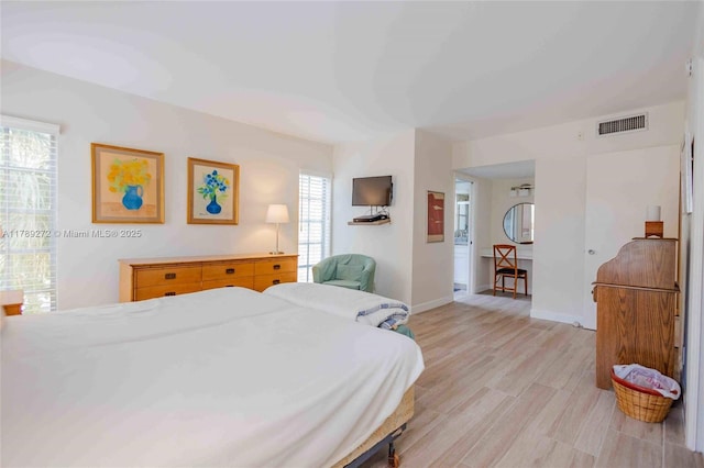 2751 N Palm Aire Dr Unit 310, Pompano Beach, FL 33069 - bedroom with baseboards and light wood finished floors