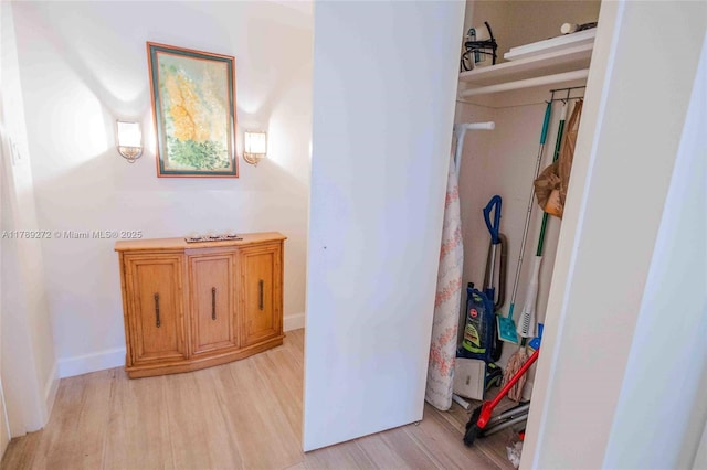 2751 N Palm Aire Dr Unit 310, Pompano Beach, FL 33069 - hallway with light wood-style flooring and baseboards