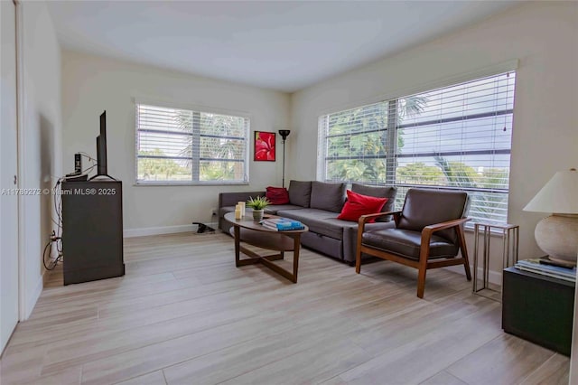2751 N Palm Aire Dr Unit 310, Pompano Beach, FL 33069 - living area with light wood-type flooring and baseboards