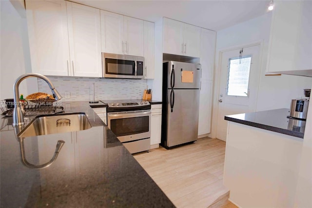 2751 N Palm Aire Dr Unit 310, Pompano Beach, FL 33069 - kitchen featuring appliances with stainless steel finishes, a sink, and white cabinetry