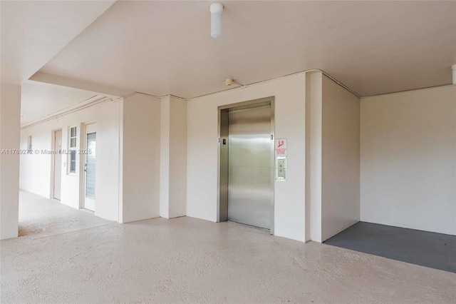 2751 N Palm Aire Dr Unit 310, Pompano Beach, FL 33069 - empty room with elevator