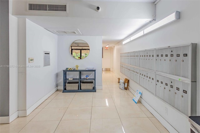 2751 N Palm Aire Dr Unit 310, Pompano Beach, FL 33069 - hallway with mail area, tile patterned flooring, and baseboards