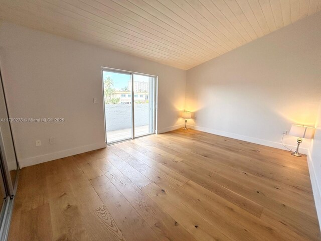 3811 NE 166th St Unit 3, North Miami Beach, FL 33160 - spare room featuring baseboards, light wood-style flooring, and wooden ceiling
