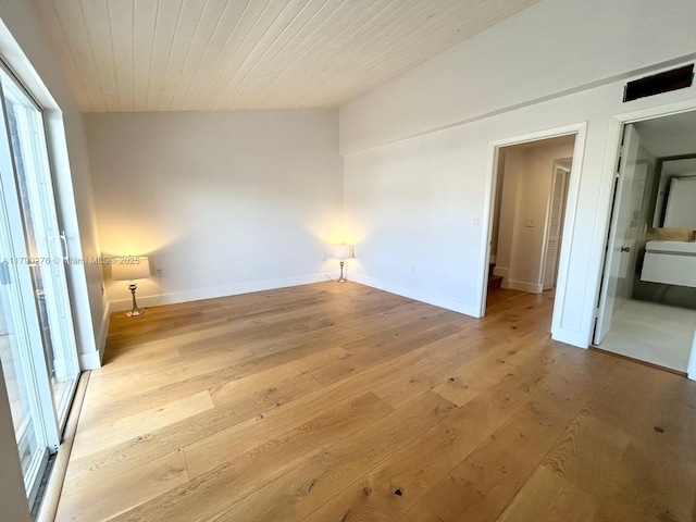 unfurnished bedroom featuring baseboards and light wood-style floors