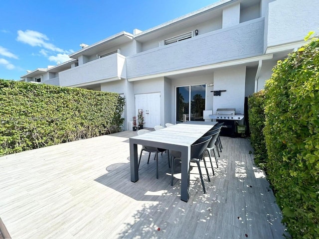 exterior space featuring outdoor dining space and area for grilling
