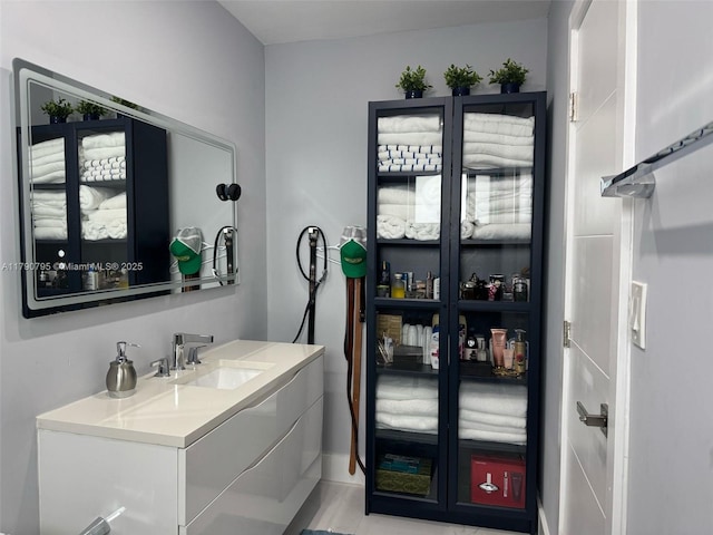 729 E 23rd St, Hialeah, FL 33013 - bathroom with vanity and baseboards