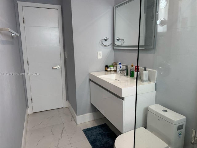 729 E 23rd St, Hialeah, FL 33013 - bathroom with baseboards, marble finish floor, toilet, and vanity