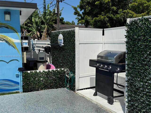 729 E 23rd St, Hialeah, FL 33013 - view of patio with fence and a grill