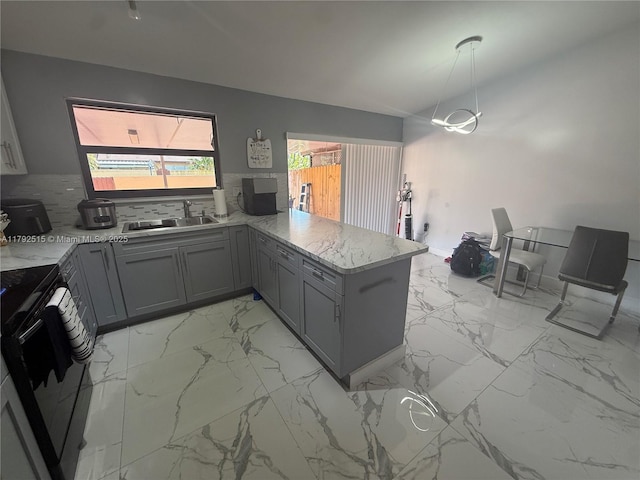 14712 SW 84th Ter, Miami, FL 33193 - kitchen with marble finish floor, a peninsula, a sink, black / electric stove, and gray cabinetry